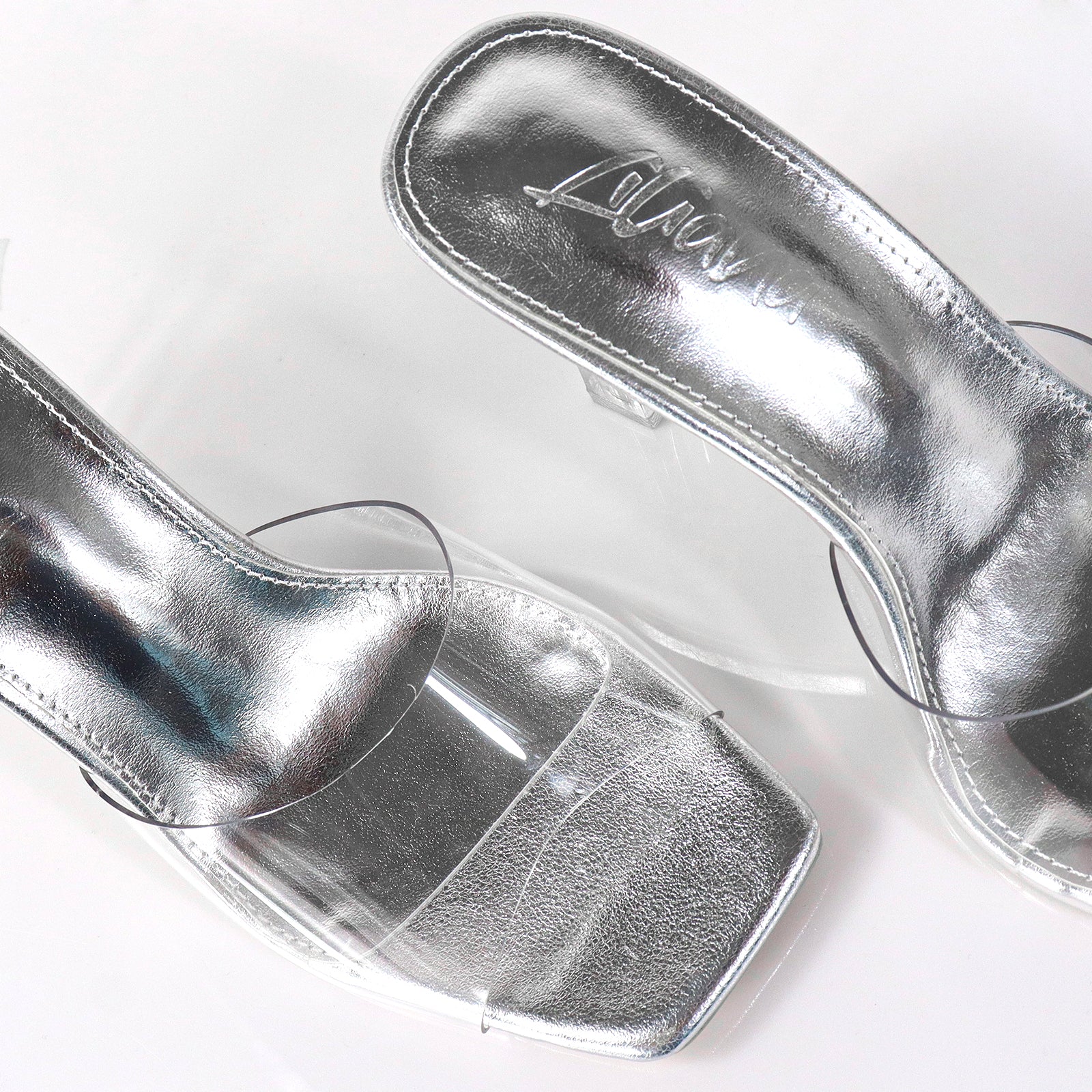 ELISA-1 CLEAR STRAP W/ RECTANGULAR PRISM HEEL SILV